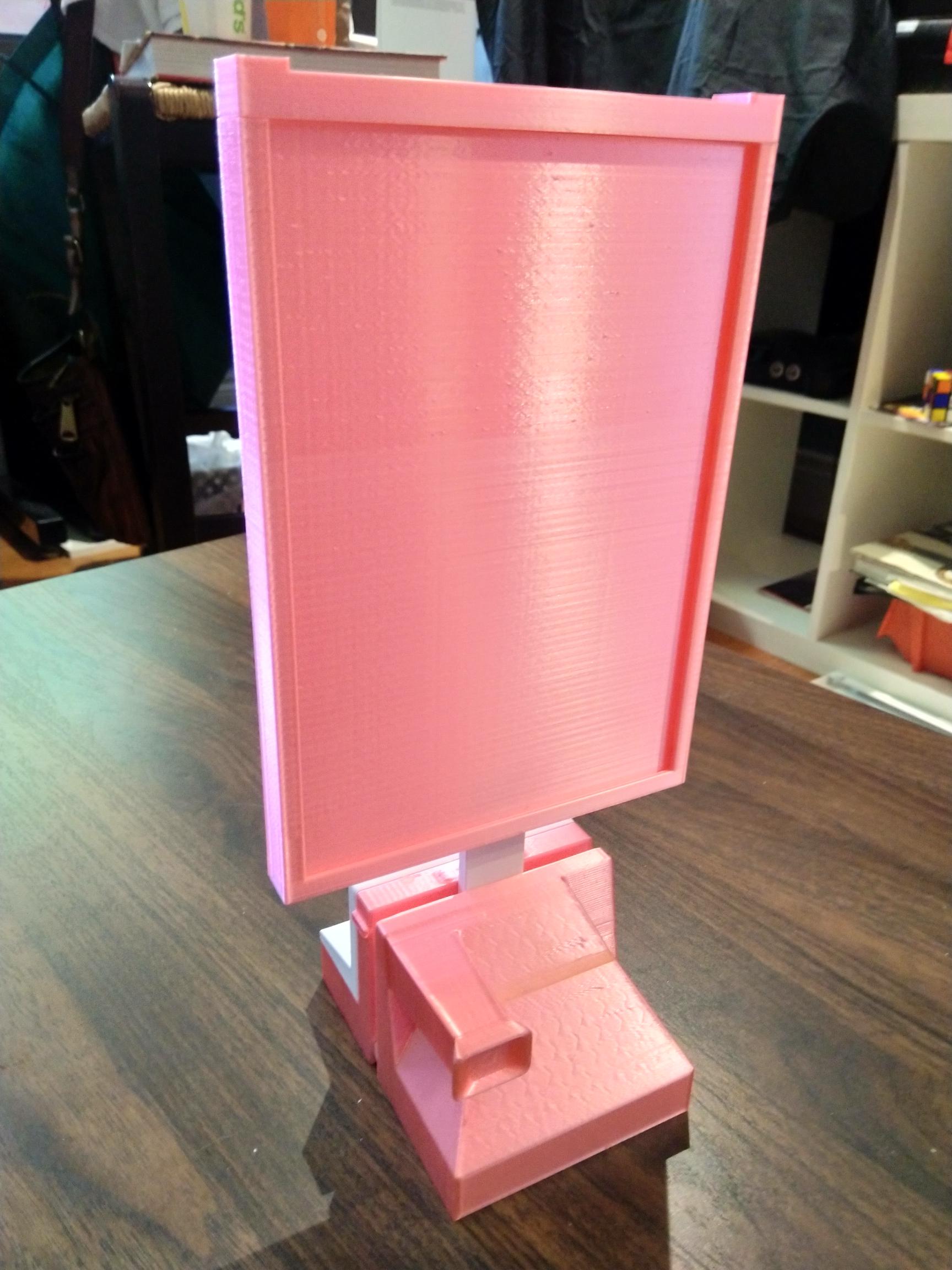 Pink frame on top of Polaroid base.